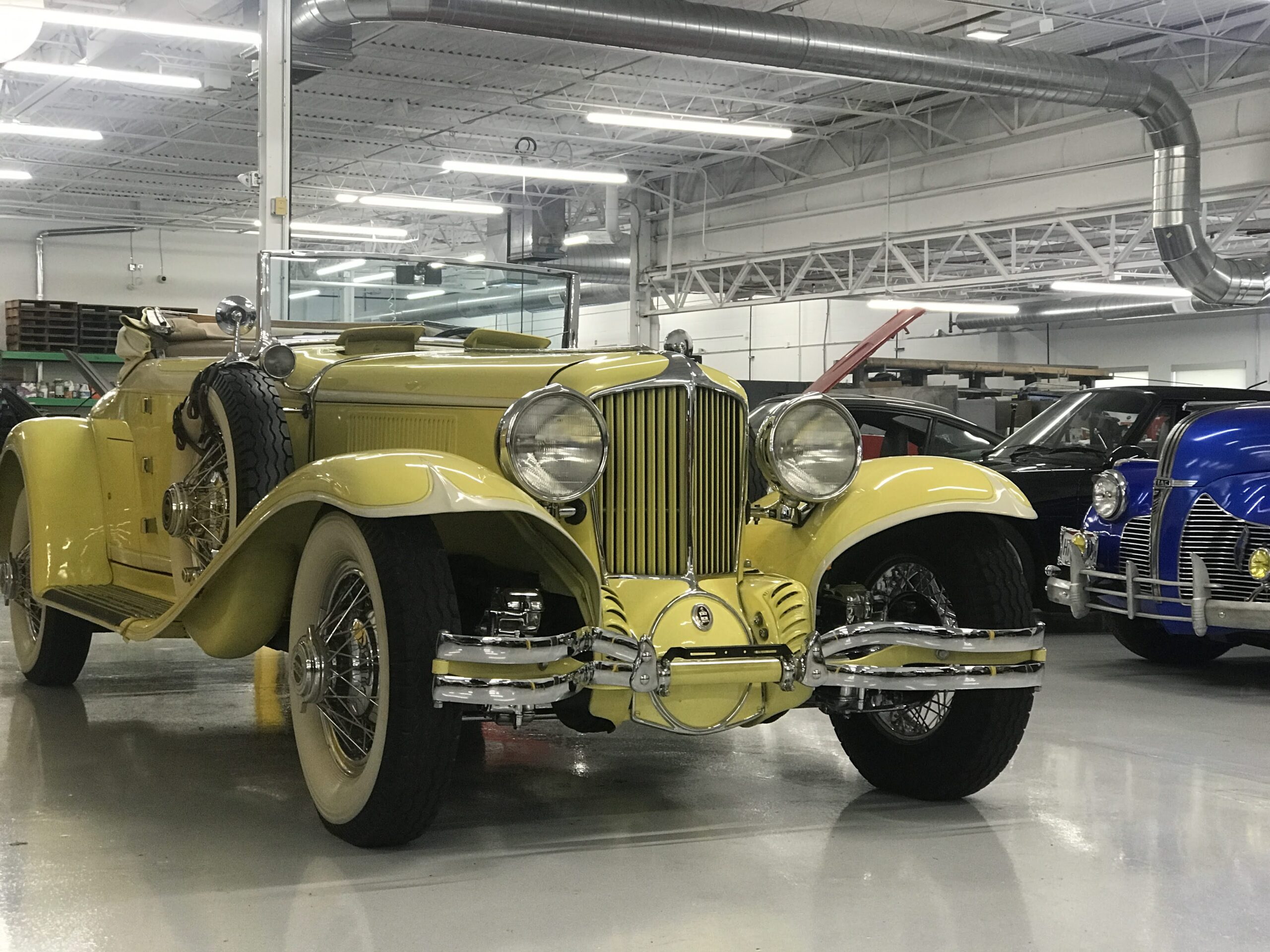Classic Car5 “Technician sanding classic car body for repainting”
