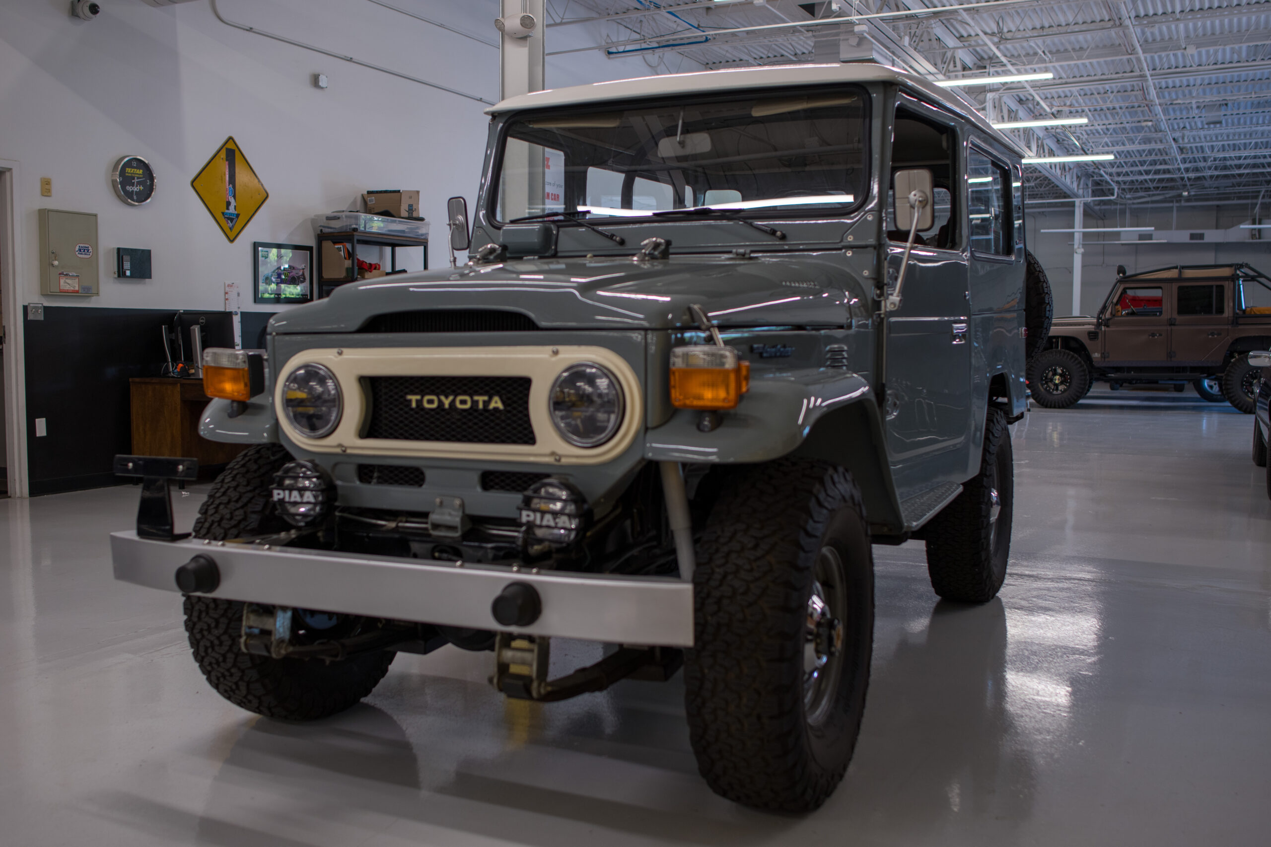 LC000 “Mechanic inspecting Land Cruiser engine”