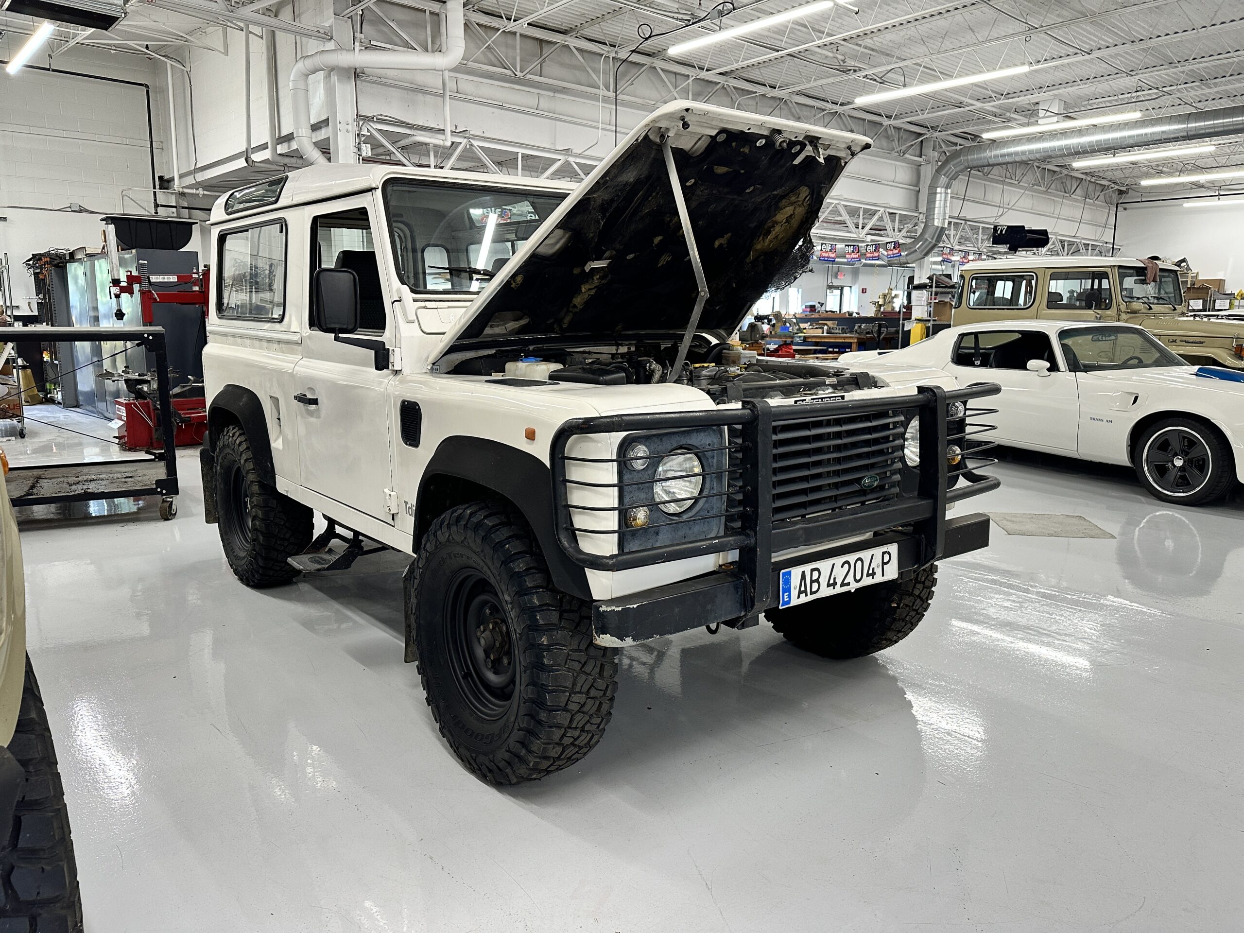 LR001 “Technician servicing Land Rover suspension”