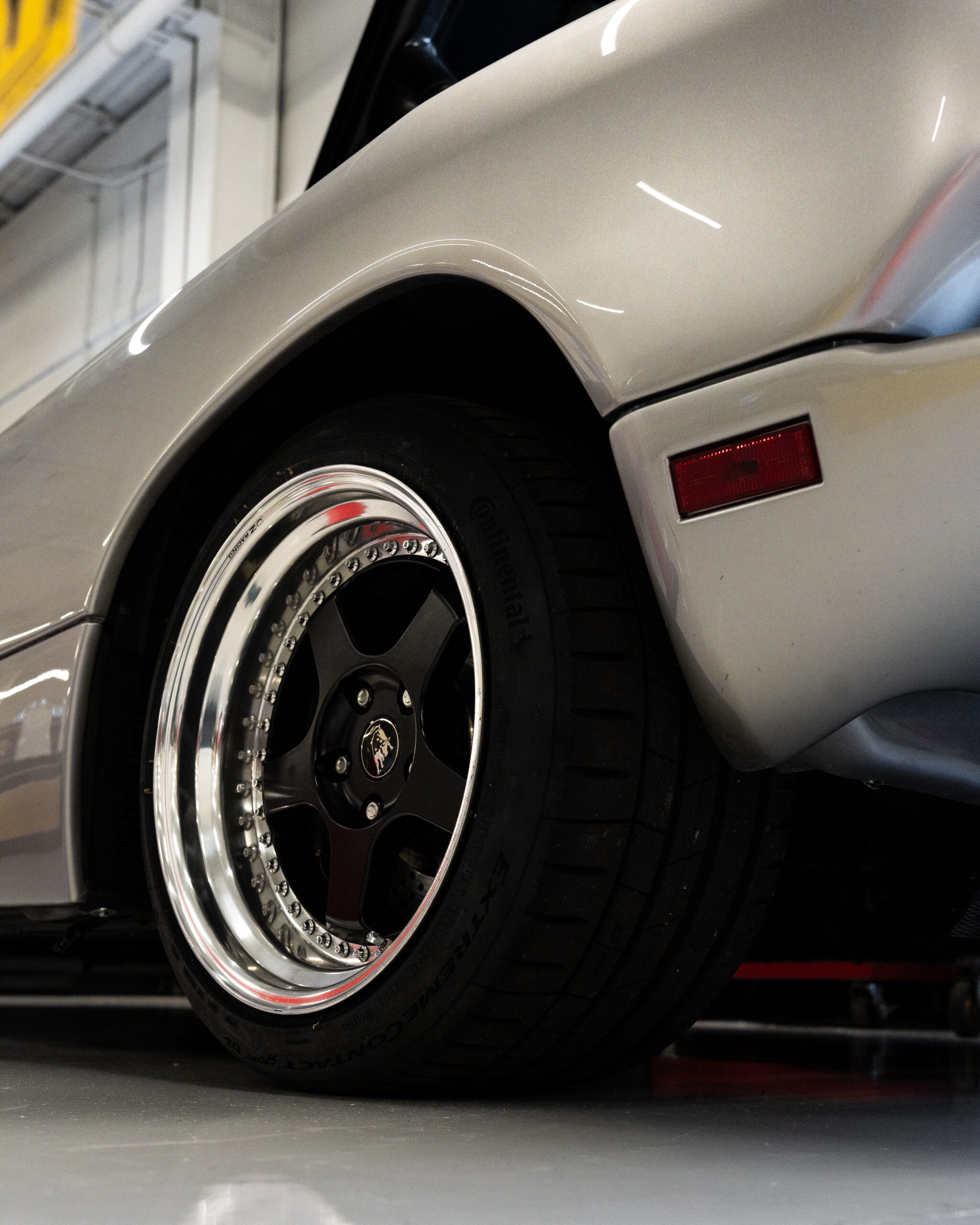 Lamborghini004 “Exotic car specialist performing diagnostic test”