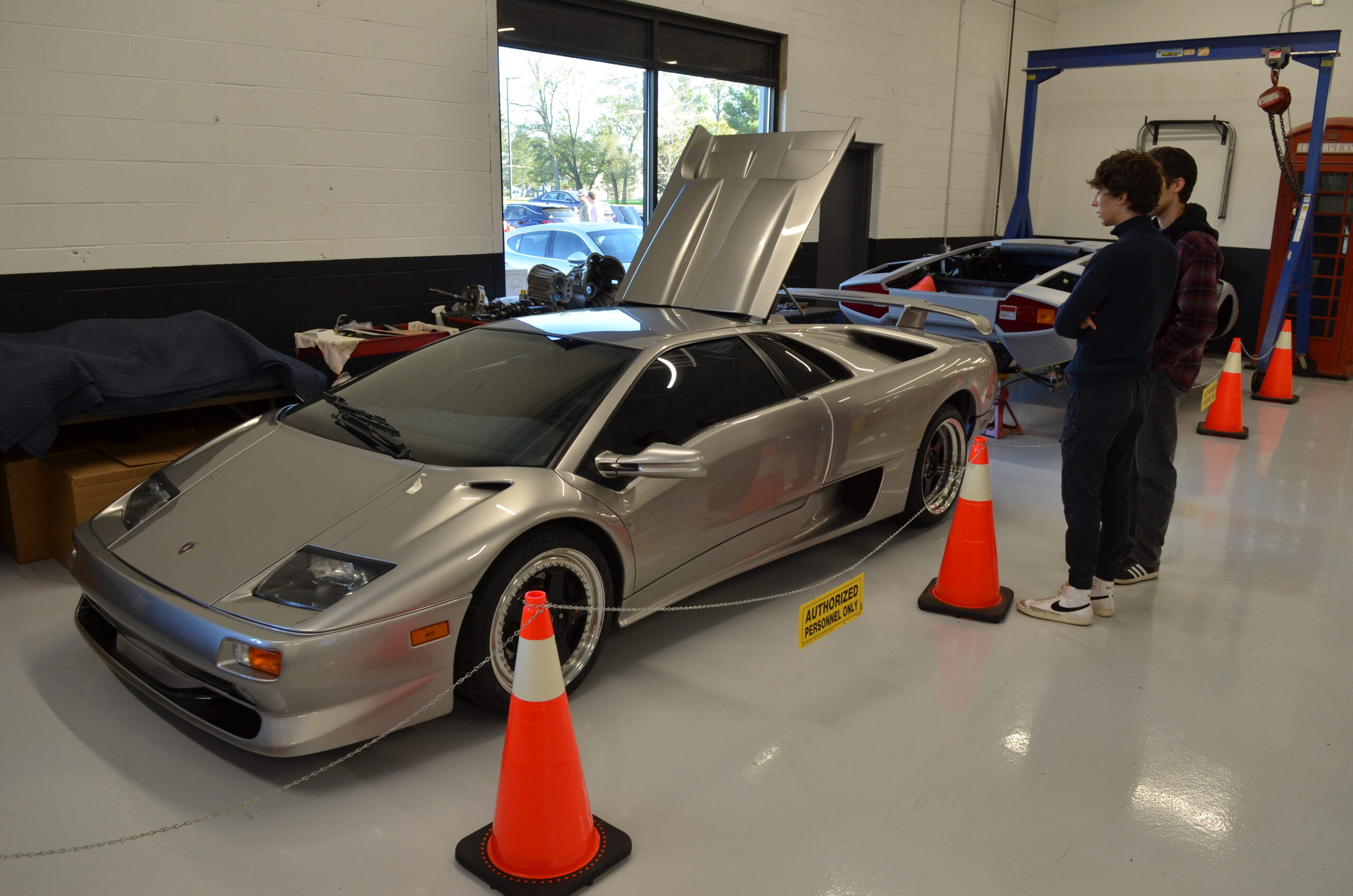 Lamborghini006 “Technician working on Lamborghini V10 engine”
